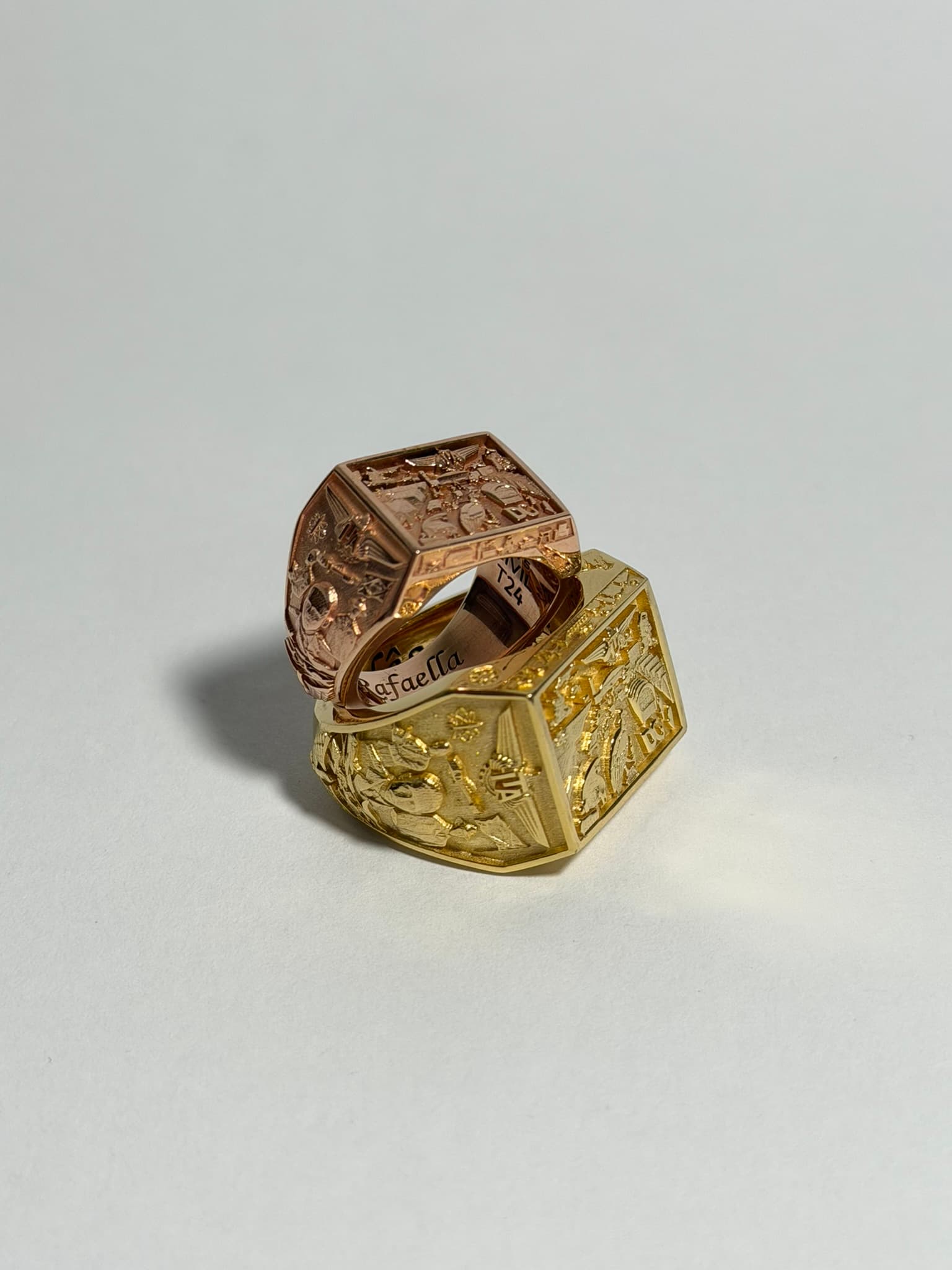 Gold signet ring on Avrati display stand