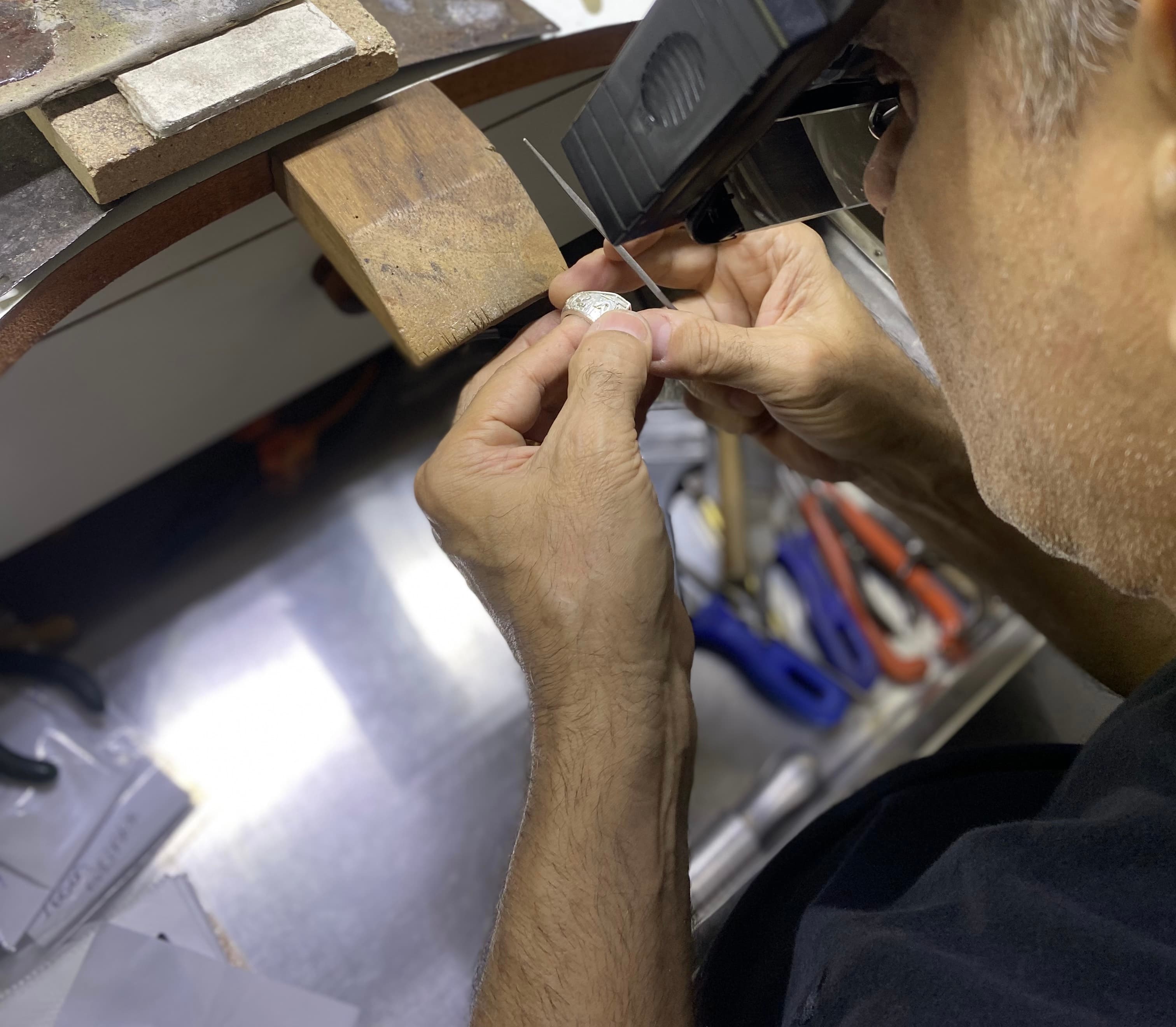 Artisan crafting jewelry by hand